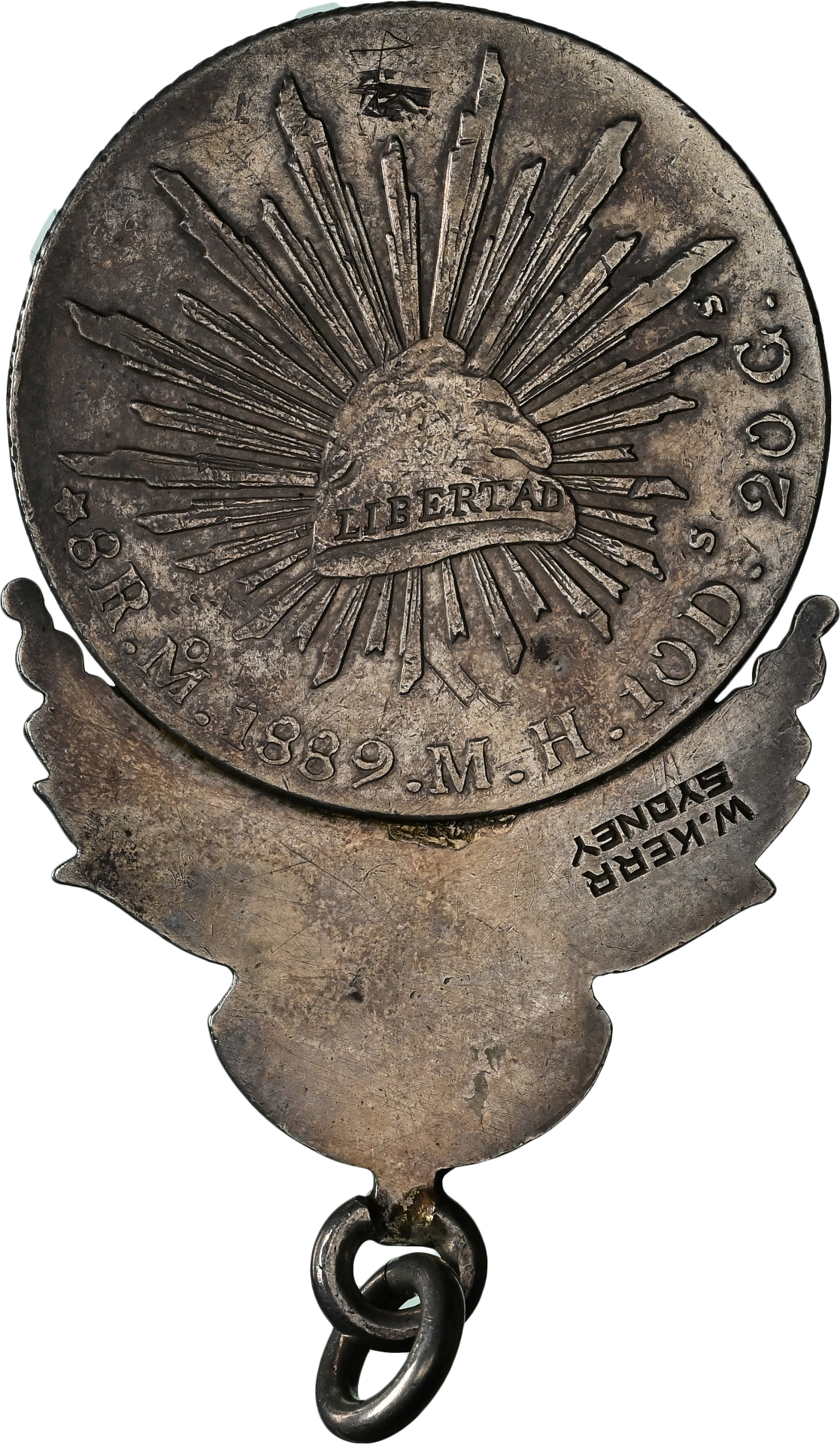 Reverse of the Kerr Sydney-Emden medal showing the Mexican coin and commemorative fitting
