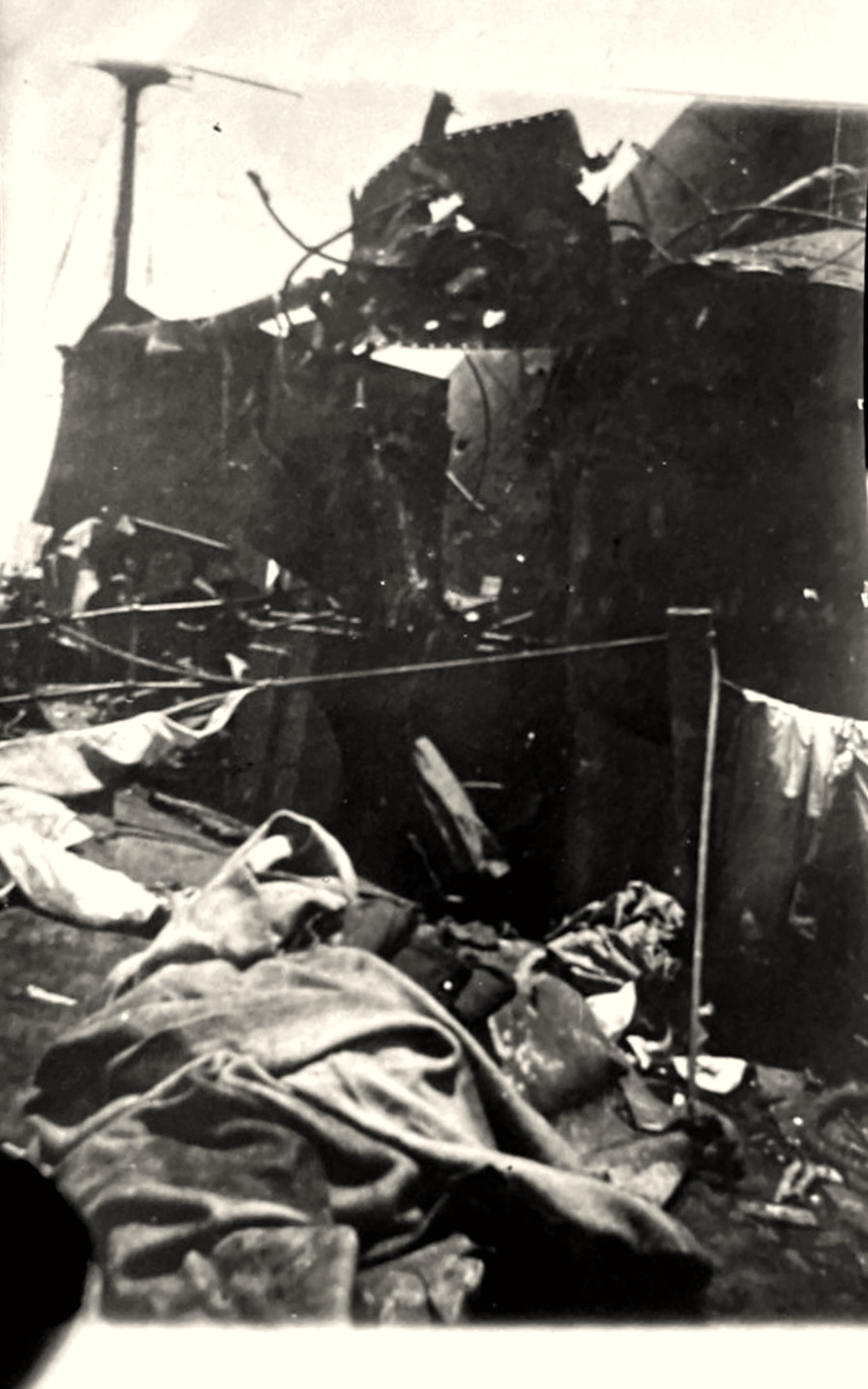 Battle wreckage on SMS Emden with the dead covered by blankets