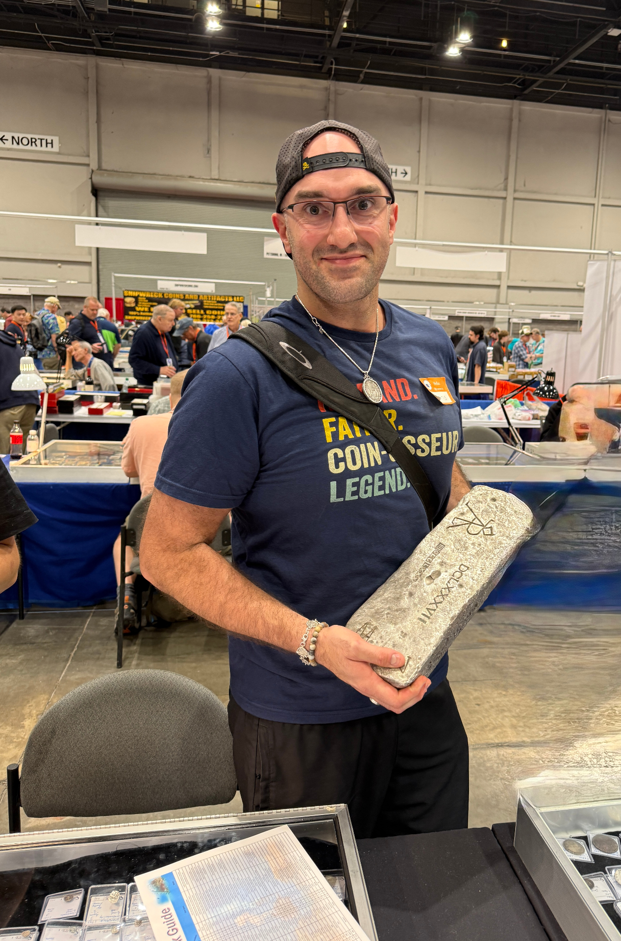 Holding an 80+ pound Atocha silver bar at the ANA World's Fair of Money